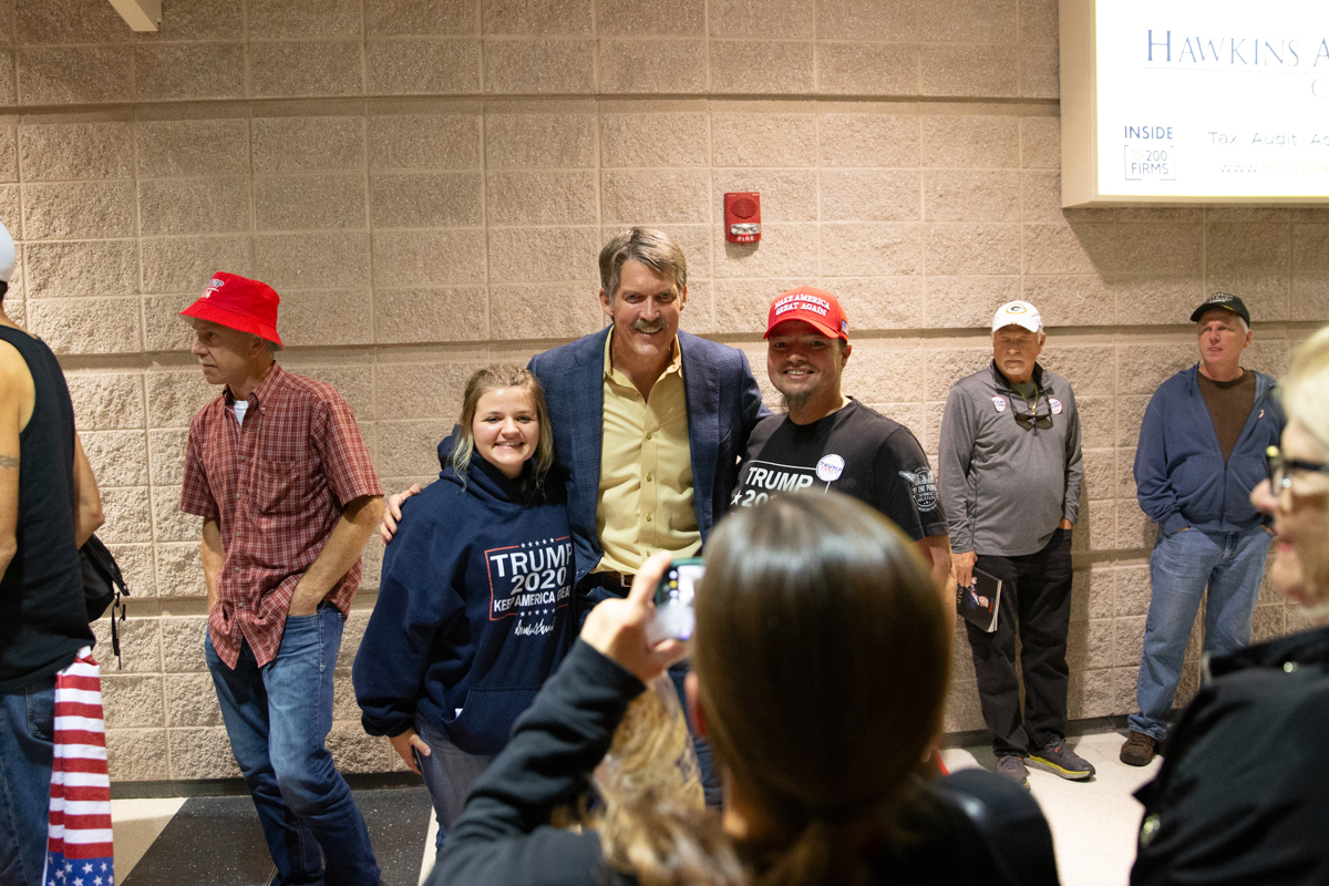 Eric Hovde stands with supporters for pictures