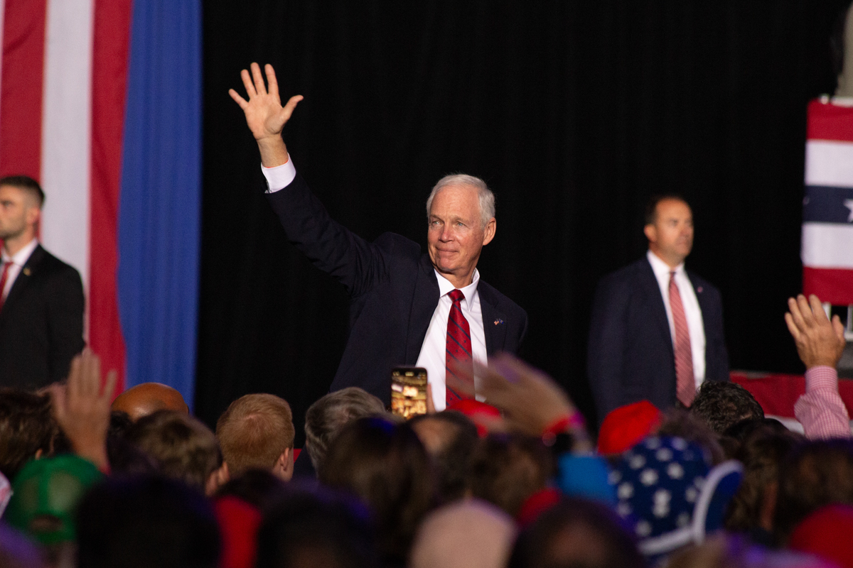 Senator Ron Johnson waves to the crowd at the Green Bay rally