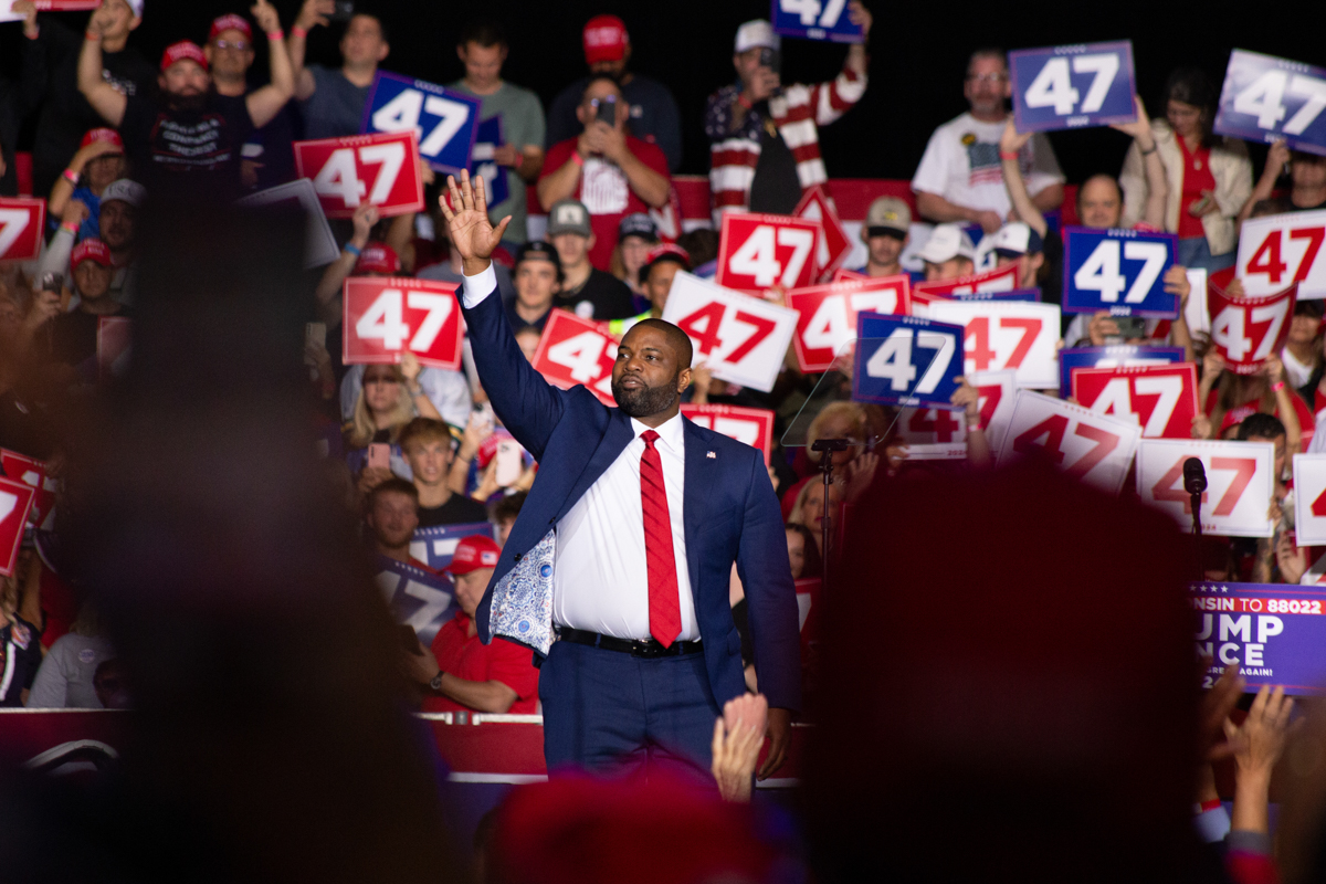 Byron Donalds waves to the crowd at the Green Bay rally