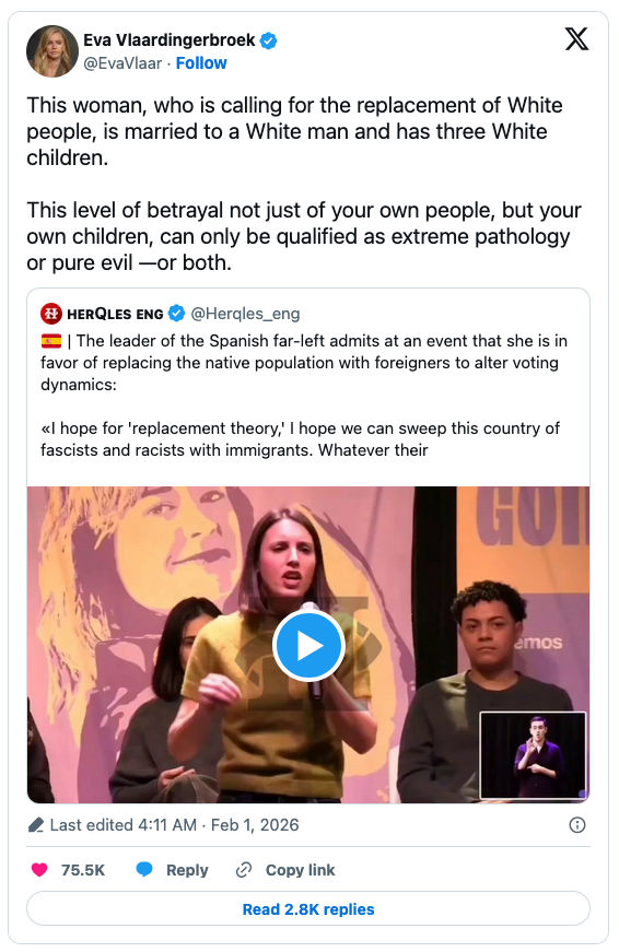 A woman speaking at an event, advocating for replacing the native population with immigrants, with a video play button overlay. People are sitting behind her on stage.