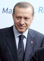 Turkish PM Visits Germany, Mocks Assimilation