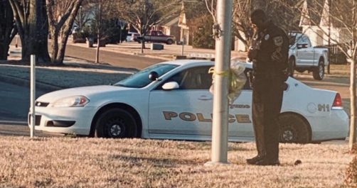 Police Officer Highlighted for Daily Prayer at School Flag Pole