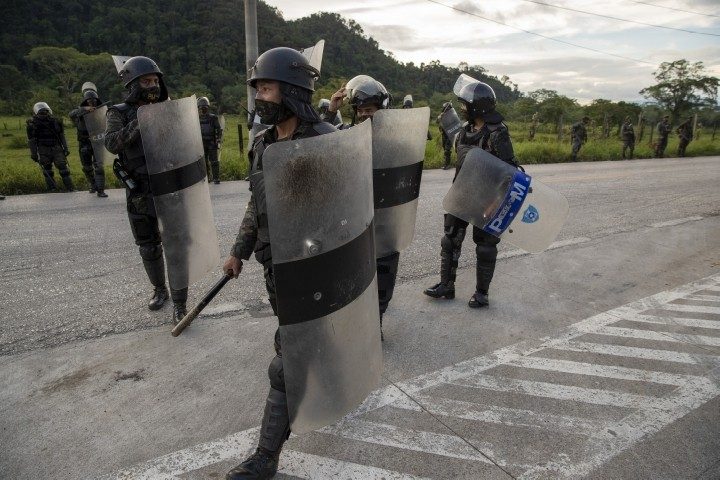 Guatemala Stops COVID Caravan Cold. Hondurans Bused Back Home.