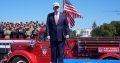 President Trump speaking outdoors on a stage at an event on the 25th anniversary of 9/11