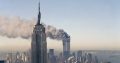 The twin towers of the World Trade Center burn behind the Empire State Building in New York on Sept. 11, 2001